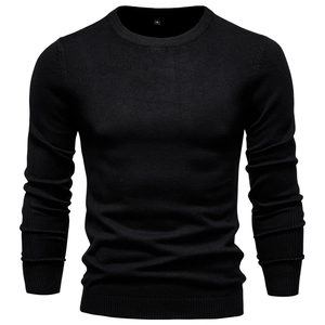Detail of classic black crew neck sweater showing fine knit texture and slim fit design