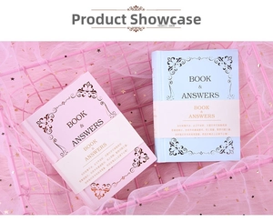 Close-up of pink and blue Book of Answers in a metal basket with star mesh decor