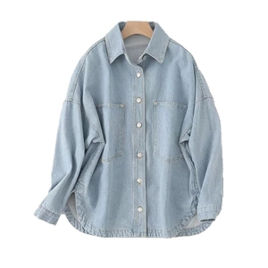 Women's light blue washed denim shirt jacket with long sleeves and dual pockets