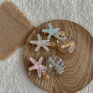 Cute starfish and seashell hair clips set with glitter and pearls for girls