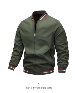 Detail of olive green bomber jacket with red and white striped ribbed cuffs and collar