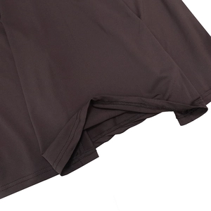 Detailed close-up showing the double-stitched hem and smooth fabric of the brown dress