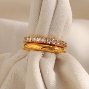 Close-up of double-layered 18K gold-plated rings with high-clarity cubic zirconia stones