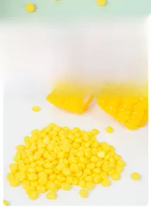 Detailed macro view of realistic miniature resin yellow corn kernels for DIY craft projects