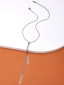Detail showing the adjustable Y-shaped silver geometric necklace with rectangle pendants