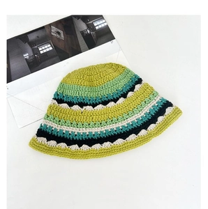 Detailed close-up of handmade crochet bucket hat featuring colorful striped knitted texture