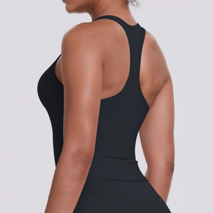 Close-up of racerback design on women's black compression sports top for yoga and running