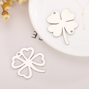 Titanium steel four-leaf clover pendants for women shown in silver solid and hollow styles