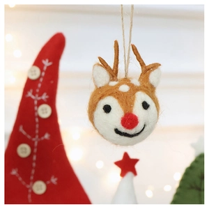 Close-up of handmade brown wool felt reindeer ornament with red nose and hanging rope