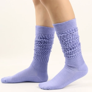 Detail of lavender purple slouch socks with thick knitted bubble texture for warm leg wear