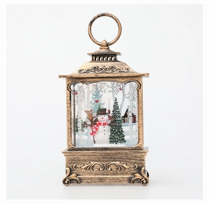 Detail of bronze Christmas lantern featuring snowmen, trees and intricate relief base