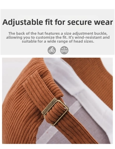 Detail of adjustable metal buckle and corduroy texture on the back of baseball cap