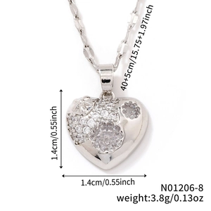 Detailed macro view of heart pendant with cubic zirconia inlay and refined silver finish