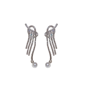 Silver knot tassel earrings with sparkling zircon and white pearl drops in a luxury style