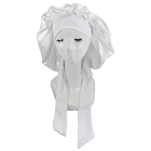 Detail of white satin sleep cap with adjustable wide ribbon ties on mannequin head