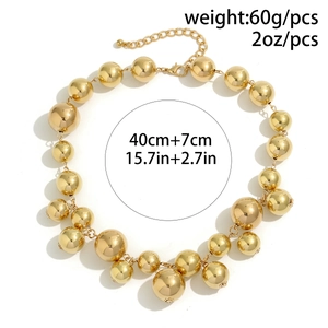Close-up of gold oversized bead choker necklace showing measurements and weight specs