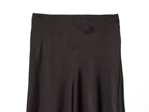 Detailed view of black satin midi skirt fabric showing smooth texture and lace trim