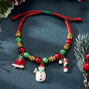 Handmade Christmas braided red rope bracelet with Santa charms and festive beads