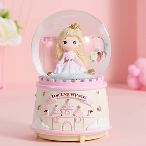 Dreamy pink castle princess crystal ball music box with floating snow on pink base