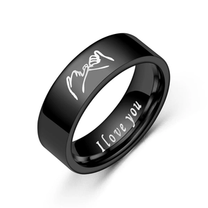 Detailed view of black titanium ring with hand-holding pattern and I Love You engraving