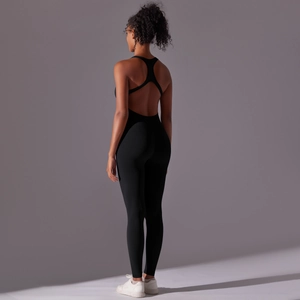 Detail shot of black seamless open back yoga bodysuit with racerback design and fitted cut