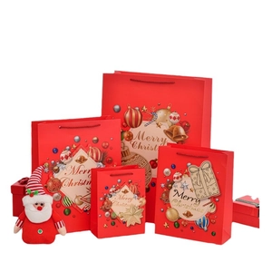 Christmas gift bag set with red holiday bells and Santa patterns in various sizes