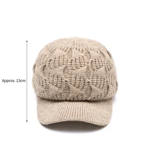 Beige knit baseball cap for women featuring thick cable knit and curved brim for winter