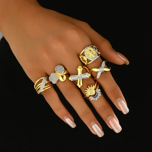 Detail of 7-piece two-tone plated rings with rhinestones and vintage motifs