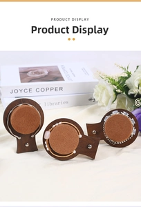 Three-piece walnut jewelry display set with velvet pads for bracelets and bangles