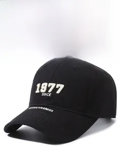 Detailed close-up of 1977 SINCE 3D embroidery on black twill cotton baseball cap