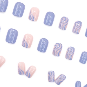 Short squoval press-on nails featuring lavender and soft pink glossy swirl patterns