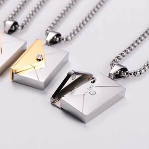 Magnetic envelope pendant necklace in silver and gold steel with hidden love you engraving