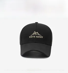 Detailed close-up of mountain peak embroidery and YOUTH DAYOFF text on a black baseball cap
