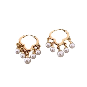 Elegant gold four-leaf clover earrings featuring five hanging white pearls on white background