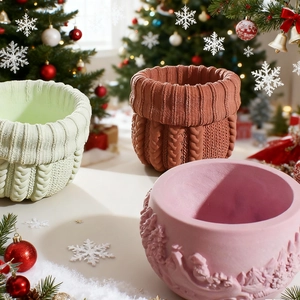 Detail of Christmas resin molds showing knit texture and relief patterns for home decor