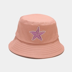 Detailed view of starfish embroidery on a cotton bucket hat with multi-row stitching