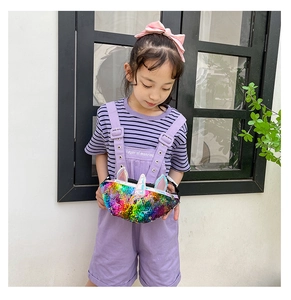 Close-up of girls unicorn fanny pack with colorful rainbow sequins and 3D ears