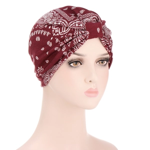 Detail view of burgundy paisley cotton headscarf cap with elegant draped layers