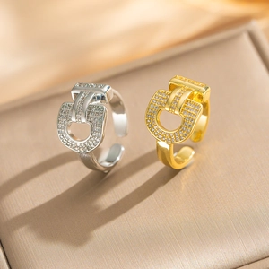 Macro detail of horseshoe-shaped rings with sparkling pavé zircons in gold and silver