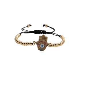Gold Hamsa Hand evil eye bracelet with colorful cubic zirconia and black braided rope