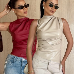 Detailed close-up of slim fit faux leather tops featuring elegant ruching and high neck design