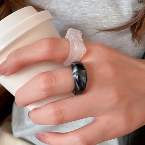 Detailed shot of two acrylic rings with marble texture and translucent resin finish