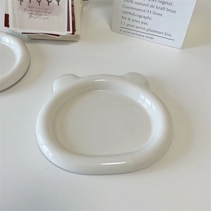 Detailed top view of a bear-shaped white ceramic plate in a minimalist ins style setting