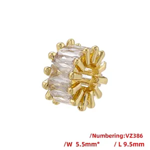 Macro detail of a 18K gold-plated barrel bead with baguette-cut zircon inlay, 9.5mm x 5.5mm size