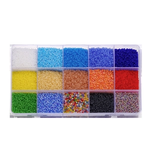 Detailed top view of 15-grid organizer box filled with colorful glass seed beads