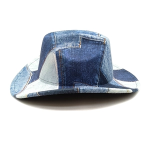 Detailed view of patchwork blue denim hat with contrast stitching and textured fabric