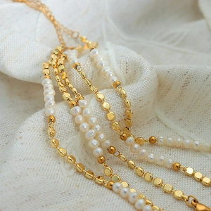 French chic style glossy gold chain bracelet featuring elegant layered freshwater pearls