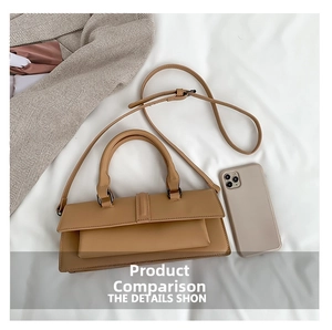 Khaki leather flap handbag with handles and shoulder strap shown with phone for size reference