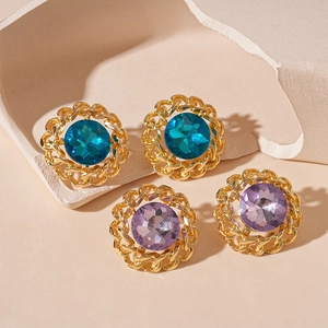 Vintage metal chain earrings with blue and purple crystals on stone pedestals