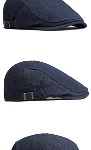 Detail der dunkelblauen Denim-Schiebermütze mit verstellbarer Bronzeschnalle und Köperstruktur